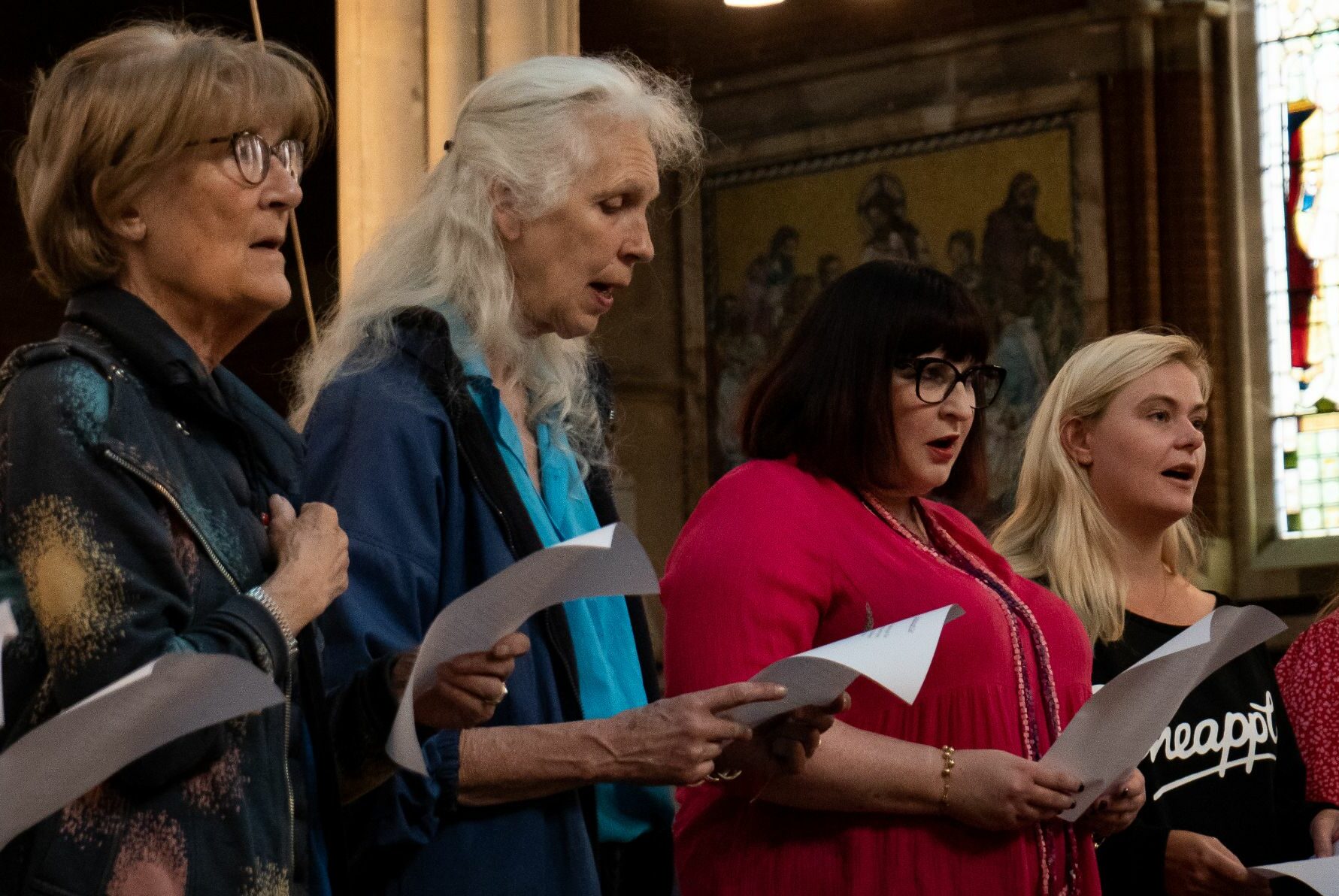four women singing in the church