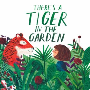a girl looking at a tiger in the garden